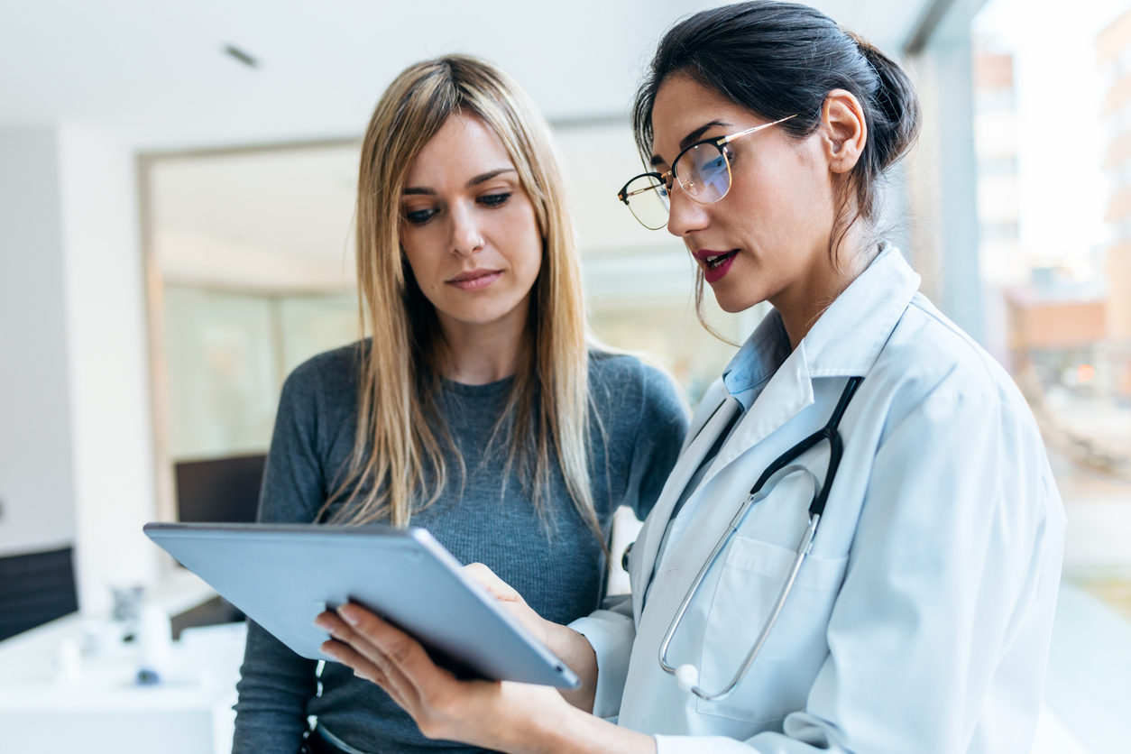 Female doctor consulting female patient