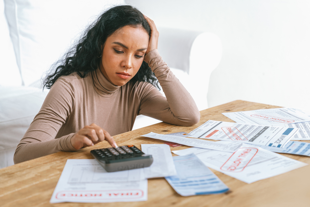 Stressed young woman whose finances are burdened by medical debt