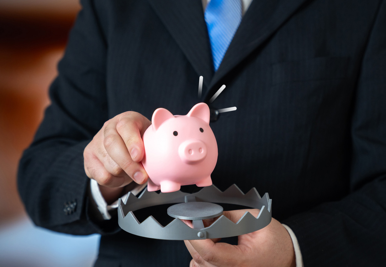 accidently buying junk insurance hurts the piggy bank. Credit: Andrii Yalanskyi Istock